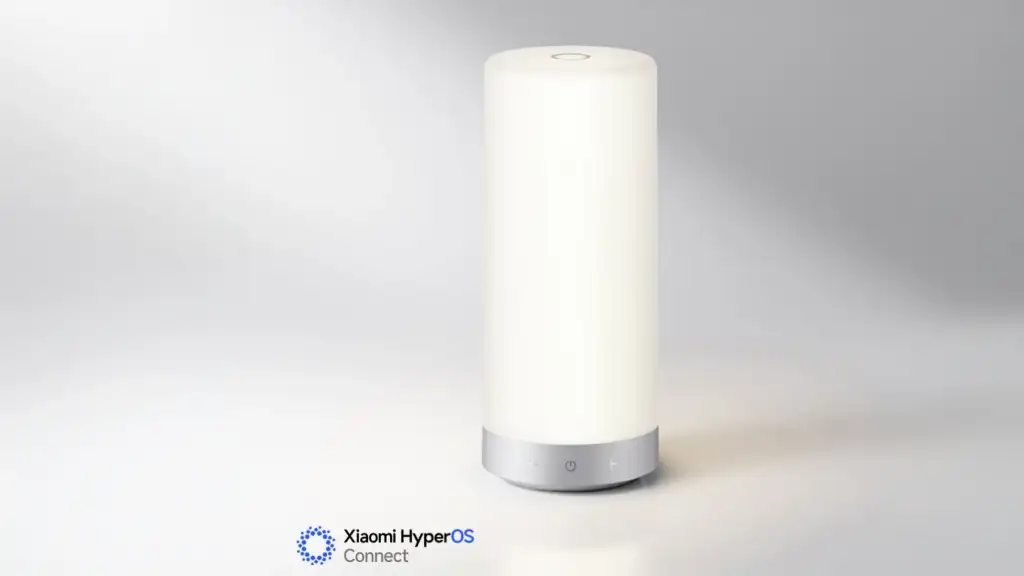 Luminária inteligente Xiaomi Mijia Bedside Lamp 3 sobre mesa de cabeceira com iluminação ambiente suave